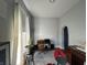 Bedroom featuring natural light, desk, chair, and drum set at 218 S 5Th Ave, Beech Grove, IN 46107