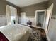 Bedroom featuring a large window and doorway and a view into another room at 218 S 5Th Ave, Beech Grove, IN 46107