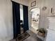 Cozy dining room with a view of the kitchen through an arched doorway at 218 S 5Th Ave, Beech Grove, IN 46107