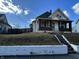 Charming two-story home with brick porch supports and inviting entry under a bright sky at 218 S 5Th Ave, Beech Grove, IN 46107