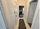 Hallway with runner leads to bedroom at 218 S 5Th Ave, Beech Grove, IN 46107