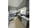 Eat-in kitchen with vintage cabinetry, updated appliances and ample light at 218 S 5Th Ave, Beech Grove, IN 46107
