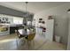 Charming eat-in kitchen features tiled floors and retro lighting fixture at 218 S 5Th Ave, Beech Grove, IN 46107