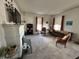 Bright living room featuring neutral paint, fireplace, and comfortable furniture at 218 S 5Th Ave, Beech Grove, IN 46107