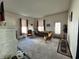 Bright living room featuring neutral paint, cozy fireplace, and comfortable furniture at 218 S 5Th Ave, Beech Grove, IN 46107