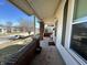 Inviting covered front porch perfect for relaxing, with brick pillars and space for seating at 218 S 5Th Ave, Beech Grove, IN 46107