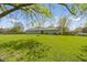 Sprawling backyard ideal for gardening, playing, and enjoying the outdoors at 2230 Mindy Ct, Anderson, IN 46017
