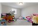 Versatile room with neutral tones, carpeted floors and window, adaptable to many uses at 2230 Mindy Ct, Anderson, IN 46017