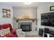 Charming fireplace serves as a focal point, adding warmth and character to the living space at 2230 Mindy Ct, Anderson, IN 46017