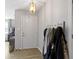 Bright foyer with a white front door, decorative lighting, and a coat rack for practical storage at 2230 Mindy Ct, Anderson, IN 46017