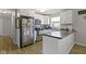 Bright kitchen featuring white cabinets, modern appliances, and sleek countertops at 2230 Mindy Ct, Anderson, IN 46017
