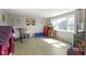 Well-lit living room with durable floors and large windows, offering ample natural light at 2230 Mindy Ct, Anderson, IN 46017