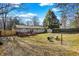 Spacious backyard features a deck, lawn chairs, storage shed, and a well-maintained lawn, perfect for outdoor enjoyment at 265 Goodnight Rd, Martinsville, IN 46151