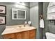 Bathroom featuring vanity with a soft-toned sink, framed art, and traditional fixtures at 265 Goodnight Rd, Martinsville, IN 46151