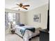 Inviting bedroom with cozy bed, decor accents, a ceiling fan, and a sunlit window at 265 Goodnight Rd, Martinsville, IN 46151