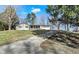 Charming single-story home featuring a stone facade, covered porch, attached garage, and a gently sloping front yard at 265 Goodnight Rd, Martinsville, IN 46151