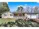 Inviting single-story home with stone accents, a cozy covered porch, and an attached two-car garage for added convenience at 265 Goodnight Rd, Martinsville, IN 46151