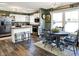 Eat-in kitchen with ample cabinetry, stainless steel appliances, a cozy breakfast nook, and natural light at 265 Goodnight Rd, Martinsville, IN 46151