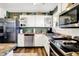 Well-lit kitchen features stainless steel appliances, ample countertop space, and stylish white cabinets at 265 Goodnight Rd, Martinsville, IN 46151