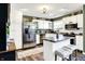 Bright kitchen featuring white cabinets, granite countertops, stainless steel appliances, and a center island at 265 Goodnight Rd, Martinsville, IN 46151
