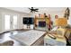 Bright living area with hardwood floors, stone fireplace, and French doors leading to the outdoor space at 265 Goodnight Rd, Martinsville, IN 46151