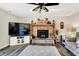 Inviting living room features hardwood floors, a ceiling fan, and a charming stone fireplace at 265 Goodnight Rd, Martinsville, IN 46151
