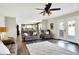 Open-concept living room with hardwood floors, ceiling fan, and natural light throughout the room at 265 Goodnight Rd, Martinsville, IN 46151