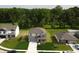 Overhead view showcasing the gray two-story home and its position in a well-kept neighborhood at 3328 Stafford St, Sheridan, IN 46069