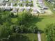 Wide aerial shot of community showcasing well-maintained green spaces and residential streets at 3328 Stafford St, Sheridan, IN 46069