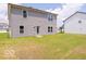 Back view of a home with gray siding and a spacious green lawn at 3328 Stafford St, Sheridan, IN 46069