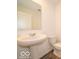 A white pedestal sink and toilet in a well-lit bathroom with tile floors at 3328 Stafford St, Sheridan, IN 46069