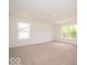 Large bedroom with plush carpeting and natural light at 3328 Stafford St, Sheridan, IN 46069