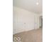 A carpeted bedroom with two paneled doors at 3328 Stafford St, Sheridan, IN 46069