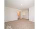 A carpeted bedroom has a view of the en-suite bathroom at 3328 Stafford St, Sheridan, IN 46069