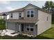 Beautiful two-story home featuring gray siding, a covered porch, and manicured landscaping at 3328 Stafford St, Sheridan, IN 46069