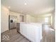 Bright kitchen with stainless steel refrigerator and a large island at 3328 Stafford St, Sheridan, IN 46069