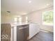 Open concept kitchen with stainless steel dishwasher and island seating at 3328 Stafford St, Sheridan, IN 46069