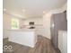 Spacious kitchen with white cabinets and an island perfect for entertaining at 3328 Stafford St, Sheridan, IN 46069