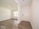 Bright living room showcasing stylish gray laminate flooring and white walls at 3328 Stafford St, Sheridan, IN 46069