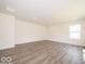 Bright living room with hardwood floors and large windows at 3328 Stafford St, Sheridan, IN 46069