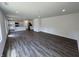 Spacious open concept living room featuring modern flooring, ample natural light, and open access to the kitchen at 3328 Stafford St, Sheridan, IN 46069