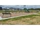 Community playground and play structure including swings and a slide, within the neighborhood at 3328 Stafford St, Sheridan, IN 46069