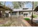 The backyard offers a brick patio and a covered trellis, perfect for outdoor entertaining at 3750 Totem Ln, Indianapolis, IN 46208