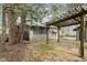 The backyard features a brick patio and mature trees, creating a peaceful outdoor space at 3750 Totem Ln, Indianapolis, IN 46208