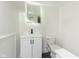 This bathroom features a modern vanity, toilet, and mirror with sleek design at 3750 Totem Ln, Indianapolis, IN 46208