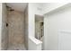 This bathroom has a tiled shower and updated shower head at 3750 Totem Ln, Indianapolis, IN 46208