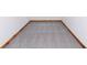The carpeted flooring is a neutral color with wood trim along the walls in this room at 3750 Totem Ln, Indianapolis, IN 46208