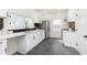 Bright kitchen featuring white cabinets, stainless steel appliances, and stylish subway tile at 3750 Totem Ln, Indianapolis, IN 46208