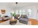 Spacious living room with natural light, hardwood floors, and neutral decor at 3750 Totem Ln, Indianapolis, IN 46208