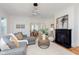 Elegant living room with a fireplace, modern lighting, and an open floor plan at 3750 Totem Ln, Indianapolis, IN 46208